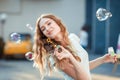 Happy woman blowing soap bubbles Royalty Free Stock Photo