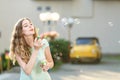 Happy woman blowing soap bubbles Royalty Free Stock Photo