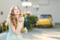 Happy woman blowing soap bubbles Royalty Free Stock Photo