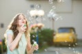 Happy woman blowing soap bubbles Royalty Free Stock Photo