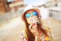 Happy woman blowing soap bubbles Royalty Free Stock Photo