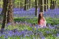 Happy woman in bluebells forest Royalty Free Stock Photo