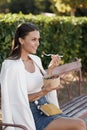 Happy woman with bowl fitness food salmon and vegetables, caucasian woman outdoor