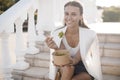 Happy woman with bowl fitness food salmon and vegetables, caucasian woman outdoor