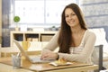 Happy woman with breakfast and laptop Royalty Free Stock Photo