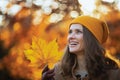 Happy woman in brown coat and yellow hat Royalty Free Stock Photo