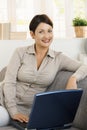 Happy woman browsing internet at home Royalty Free Stock Photo