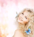 Happy woman with butterflies in hair Royalty Free Stock Photo