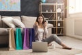 Happy woman buying online with laptop and credit card Royalty Free Stock Photo