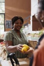 Happy woman buying organic fruits Royalty Free Stock Photo