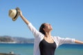 Happy woman celebrating on the beach Royalty Free Stock Photo