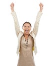 Happy woman, celebration and fist pump in winning, bonus or promotion on a white studio background. Excited young female