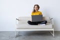 Happy woman chatting online on laptop. Smiling blonde woman messaging with friends on computer. Social media, communication and