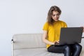 Happy woman chatting online on laptop. Smiling blonde woman messaging with friends on computer. Social media, communication and