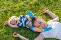 Happy woman and child having fun outdoor on meadow Royalty Free Stock Photo