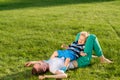 Happy woman and child having fun outdoor on meadow Royalty Free Stock Photo