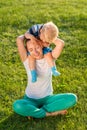 Happy woman and child having fun outdoor on meadow Royalty Free Stock Photo