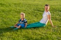 Happy woman and child having fun outdoor on meadow Royalty Free Stock Photo