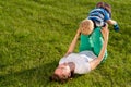 Happy woman and child having fun outdoor on meadow Royalty Free Stock Photo