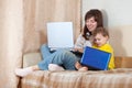 Happy woman and child with laptops Royalty Free Stock Photo