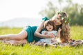 Happy woman with a child resting on the nature Royalty Free Stock Photo