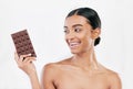 Happy woman, chocolate and sweet candy for diet or unhealthy food against a white studio background. Female person or Royalty Free Stock Photo