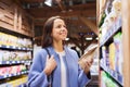 Happy woman choosing and buying food in market Royalty Free Stock Photo
