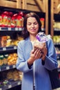 Happy woman choosing and buying food in market Royalty Free Stock Photo