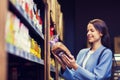 Happy woman choosing and buying food in market Royalty Free Stock Photo