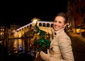 Happy woman with Christmas tree near Rialto Bridge in Venice Royalty Free Stock Photo