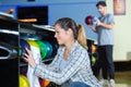happy woman cleaning bowling ball Royalty Free Stock Photo