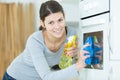 happy woman cleaning cooker at home kitchen Royalty Free Stock Photo