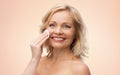 Happy woman cleaning face with cotton pad Royalty Free Stock Photo