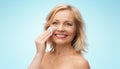 Happy woman cleaning face with cotton pad Royalty Free Stock Photo