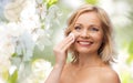 Happy woman cleaning face with cotton pad Royalty Free Stock Photo