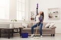 Happy woman cleaning home with mop and having fun Royalty Free Stock Photo