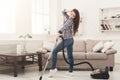 Happy woman cleaning home with vacuum cleaner Royalty Free Stock Photo