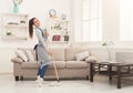 Happy woman cleaning home with mop and having fun Royalty Free Stock Photo