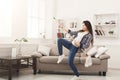 Happy woman cleaning home with mop and having fun Royalty Free Stock Photo