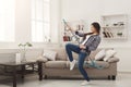 Happy woman cleaning home with mop and having fun Royalty Free Stock Photo