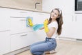 Happy woman cleaning home, singing . Housework, chores concept.Girl cleaning the house. House cleaning service.A beautiful Royalty Free Stock Photo