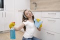 Happy woman cleaning home, singing . Housework, chores concept.Girl cleaning the house. House cleaning service.A beautiful Royalty Free Stock Photo
