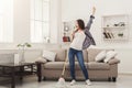 Happy woman cleaning home with mop and having fun Royalty Free Stock Photo