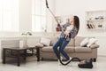 Happy woman cleaning home with vacuum cleaner Royalty Free Stock Photo