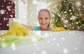 Happy woman cleaning table at home kitchen Royalty Free Stock Photo