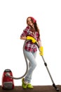 Happy woman cleans with vacuum cleaner isolated over white background Royalty Free Stock Photo