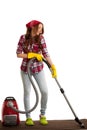 Happy woman cleans with vacuum cleaner isolated over white background Royalty Free Stock Photo