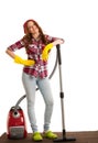 Happy woman cleans with vacuum cleaner isolated over white background Royalty Free Stock Photo