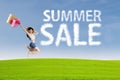Happy woman with cloud of summer sale Royalty Free Stock Photo