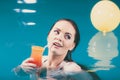 Happy woman with cocktail in water. Royalty Free Stock Photo